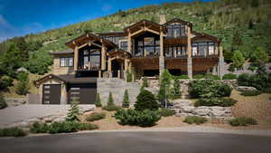 View of front facade featuring a garage