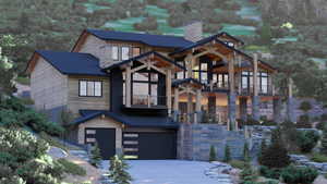 View of front facade featuring a garage and a balcony