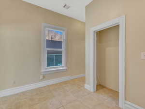 Interior space with light tile patterned floors