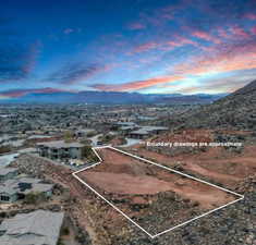 Aerial view at dusk featuring a mountain view