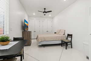 Bedroom with multiple closets and ceiling fan