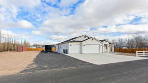 View of property exterior featuring a garage