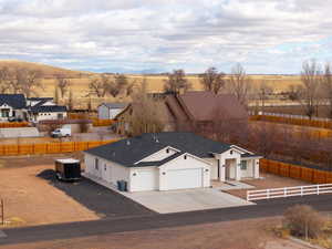 Birds eye view of property featuring a rural view and a mountain view