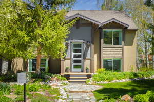 View of front of home featuring roof with shingles
