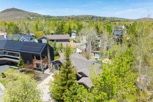 Aerial perspective of suburban area with a mountainous background