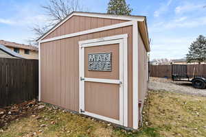 View of outdoor structure featuring a yard - "man cave"