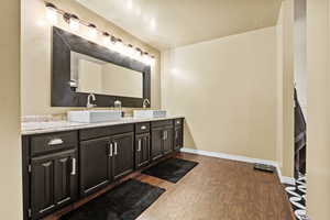 Bathroom featuring wood-type flooring and vanity