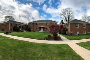 View of front of property featuring a front lawn