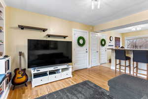 Living room with light wood-type flooring