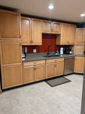 Kitchen featuring sink and stainless steel dishwasher