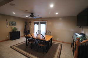 Dining area featuring french doors and ceiling fan