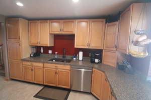 Kitchen featuring sink and stainless steel dishwasher