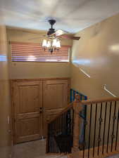 Foyer featuring ceiling fan