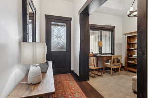 Entrance foyer with dark wood-type flooring