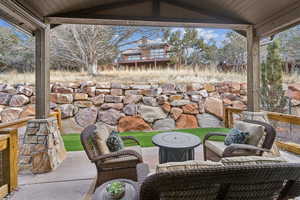 View of patio featuring an outdoor hangout area