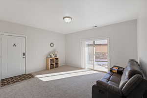 Living room with light colored carpet