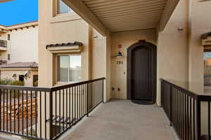 Property entrance with a balcony