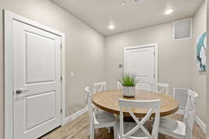 Dining space with light wood-type flooring