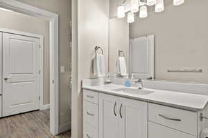 Bathroom featuring vanity and wood-type flooring