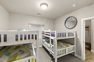 Bedroom with a textured ceiling