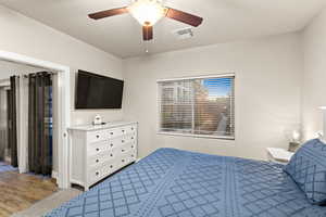 Bedroom featuring a textured ceiling and ceiling fan