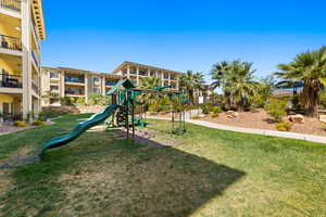 View of jungle gym with a yard