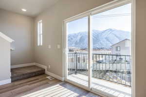 Doorway to outside featuring wood-type flooring and a mountain view