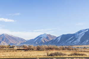 Property view of mountains with a rural view