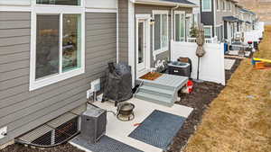 View of patio with a fire pit