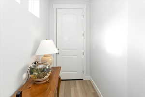 Doorway to outside featuring light hardwood / wood-style floors