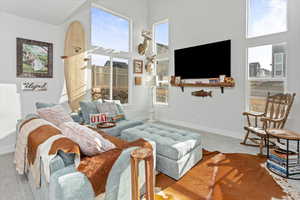 Living room featuring carpet floors and a high ceiling