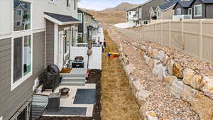 View of yard with a mountain view, a patio area, and central air condition unit