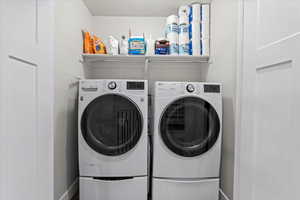 Laundry room featuring washing machine and clothes dryer