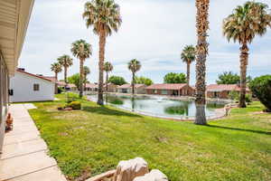 View of yard with a water view