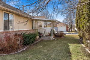 View of property exterior featuring a lawn