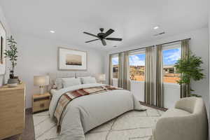 Bedroom with ceiling fan, light colored carpet, visible vents, and recessed lighting