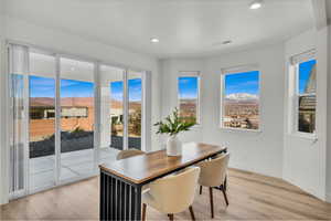 Dining area with recessed lighting, baseboards, visible vents, and light wood finished floors