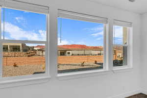 Doorway to outside featuring a mountain view and baseboards