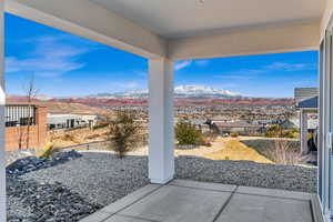 View of patio featuring a residential view, a fenced backyard, and a mountain view