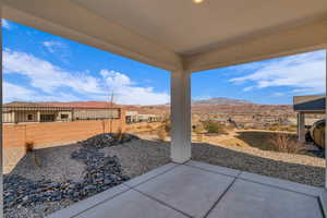 View of patio / terrace with fence private yard and a mountain view