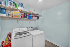 Washroom with washer and clothes dryer