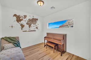 Living area featuring light hardwood / wood-style floors