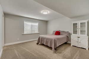 View of carpeted bedroom.