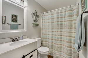 Bathroom with vanity and toilet.