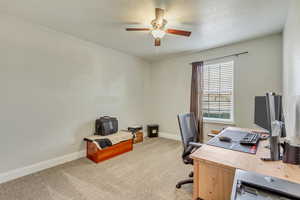 Carpeted bedroom featuring ceiling fan.