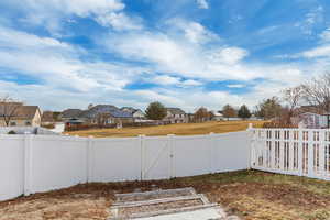 View of yard with access to park.