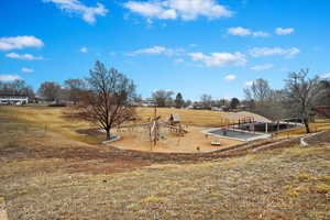 View of playground featuring a rural view