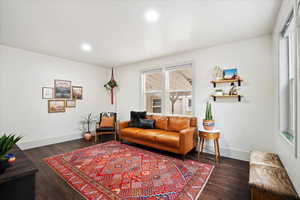 Living room with wood-type flooring