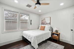 Bedroom with ceiling fan and wood-style floors