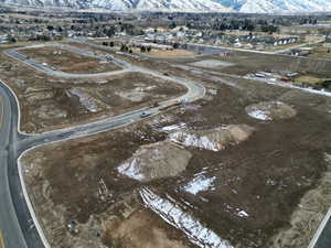 Birds eye view of property with a mountain view